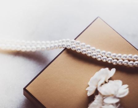 Valentine's day ideas, luxury shopping and holiday inspiration concept - Pearl jewellery in a vintage golden gift box