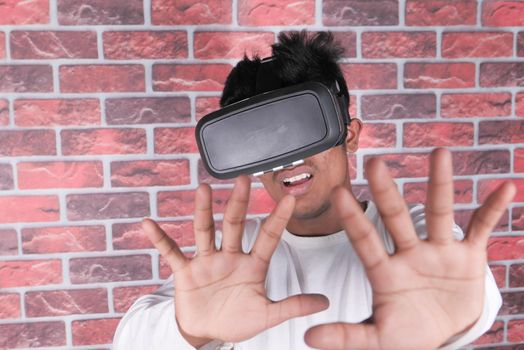 young man wearing virtual reality headset, vr box ,