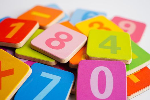 Number wood block cubes for learning Mathematic, education math concept.