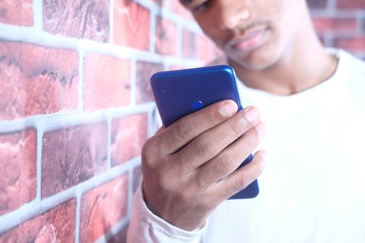 selective focus. young man hand using smart phone