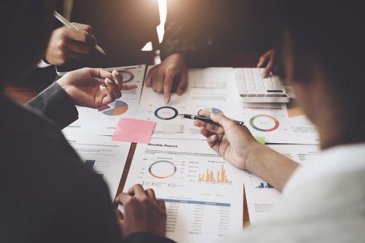 Planning to reduce investment risks, the image of a group of businesspeople working with partners is adjusting marketing strategies to analyze profitable and targeted customer needs at meetings.