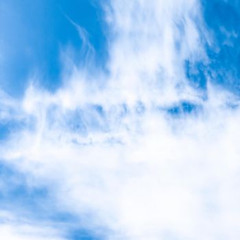 Nature backdrop, solar energy and spiritual concept - Blue sky background, white clouds and bright sunlight