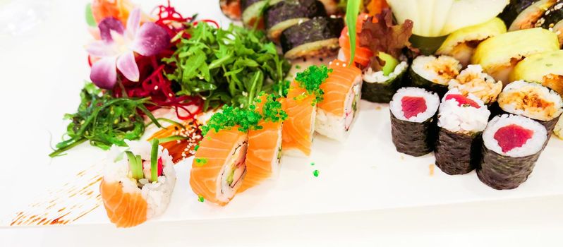 Food, travel and healthy eating concept - Japanese sushi in a restaurant at lunch time, asian cuisine