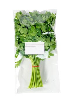 Packaged and labeled organic parsley on a white background