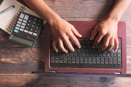 Close up of man hand typing on laptop