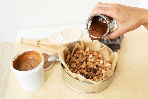 Top view of delicious peanut butter dessert along with dark chocolate dipped rice cakes. Vegan dessert, tasty and healthy