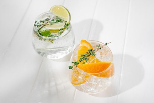 Healthy summer cocktails, mocktails. Set of different citrus lemonades mojitos, with lime, orange, diet detox drinks. Flashy food