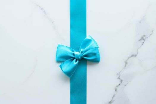 Holiday decor, feminine design and flatlay concept - Blue silk ribbon on marble, top view