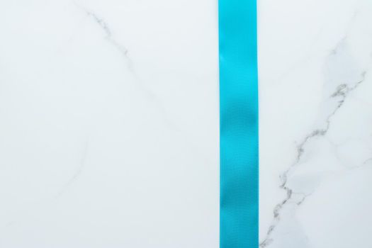 Holiday decor, feminine design and flatlay concept - Blue silk ribbon on marble, top view