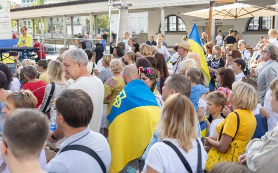 LJUBLJANA, SLOVENIA - August 24, 2022: Ukraine independence day meeting. People with flags and national symbols. High quality photo