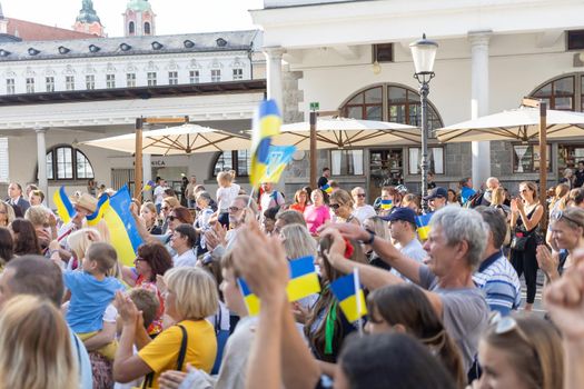 LJUBLJANA, SLOVENIA - August 24, 2022: Ukraine independence day meeting. People with flags and national symbols. High quality photo