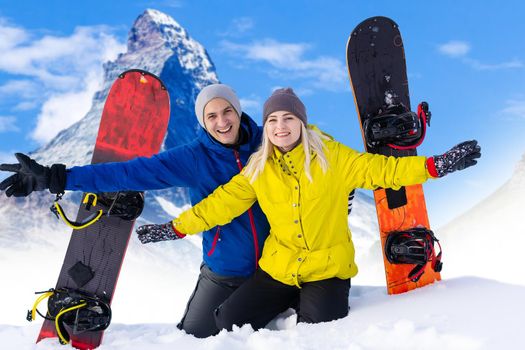 Happy family enjoying winter vacations in mountains. Playing with snow, Sun in high mountains. Winter holidays.