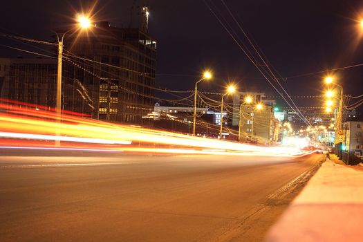 Speed Traffic at Dramatic Sundown Time - light trails on motorway highway at night, long exposure urban background