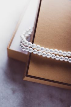 Valentine's day ideas, luxury shopping and holiday inspiration concept - Pearl jewellery in a vintage golden gift box