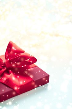 New Years Eve celebration, luxury wrapped and Valentines Day card concept - Winter holiday red gift box and glowing snow, Christmas presents surprise