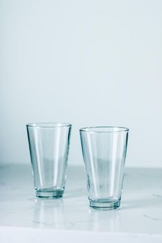 Glassware, washing and purity concept - Clean empty glasses on marble table