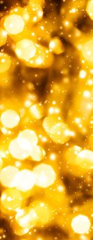 Golden Christmas lights, New Years Eve fireworks and abstract texture concept - Glamorous gold shiny glow and glitter, luxury holiday background