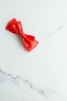 Holiday decor, feminine design and flatlay concept - Red silk ribbon on marble, top view