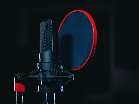 Microphone on black background in recording studio. Music, concert concept. High quality photo