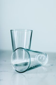 Glassware, washing and purity concept - Clean empty glasses on marble table