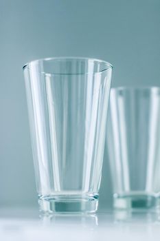 Glassware, washing and purity concept - Clean empty glasses on marble table