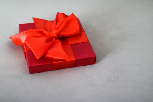 Wedding present, shop sale promotion and love celebration concept - Luxury holiday red gift box with silk ribbon and bow, christmas or valentines day decor