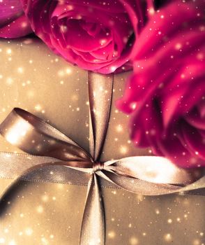 Celebration, holiday season and love concept - Valentines day present, luxury gift box and bouquet of roses with shiny snow