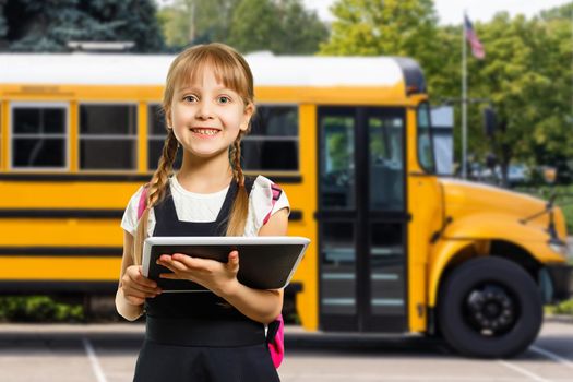 Smiling active excellent best student schoolgirl holding books and going to school wearing bag.