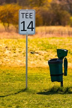 Romantic 14th tee off with a trash can on a German golf course against the light