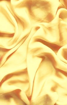 Luxury golden silk background texture - elegant fabric textures, abstract backgrounds and modern pastel colours concept