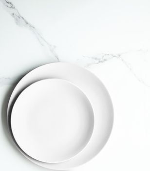 White empty plate on marble, flatlay - stylish tableware, romantic table decor and food menu concept. Serve the perfect dish