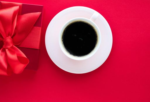 Romantic celebration, lifestyle and birthday present concept - Luxury beauty gift box and coffee on red, flatlay