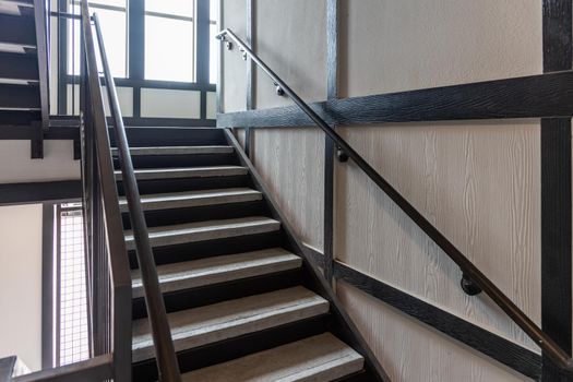 Stainless steel and wood railing. Fall Protection, modern design of handrail and staircase