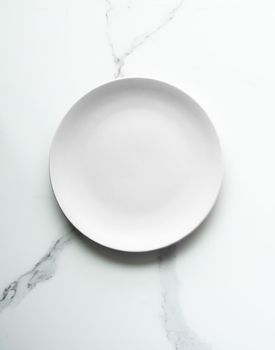 White empty plate on marble, flatlay - stylish tableware, romantic table decor and food menu concept. Serve the perfect dish