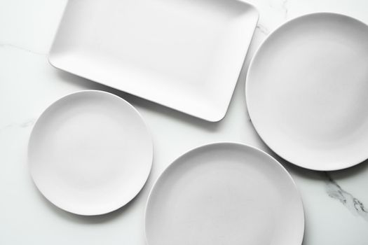 White empty plate on marble, flatlay - stylish tableware, romantic table decor and food menu concept. Serve the perfect dish