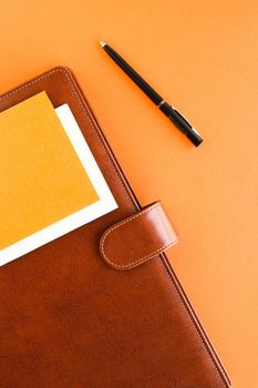 Modern workspace, productivity and corporate lifestyle concept - Luxury business brown brief-case on the office table desk, flatlay