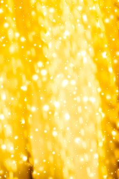 Golden Christmas lights, New Years Eve fireworks and abstract texture concept - Glamorous gold shiny glow and glitter, luxury holiday background