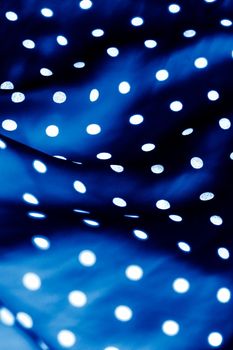Fashion design, interior decor and vintage material concept - Classic polka dot textile background texture, white dots on blue luxury fabric design pattern