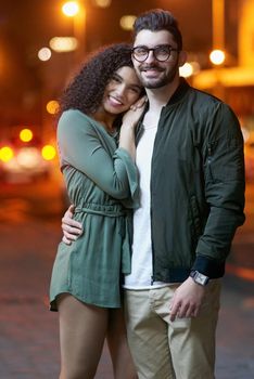 The perfect couple. Portrait of a happy young couple outdoors at night