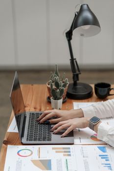 Business woman hand using laptop with bank savings account application, account or saving money or insurance concept.