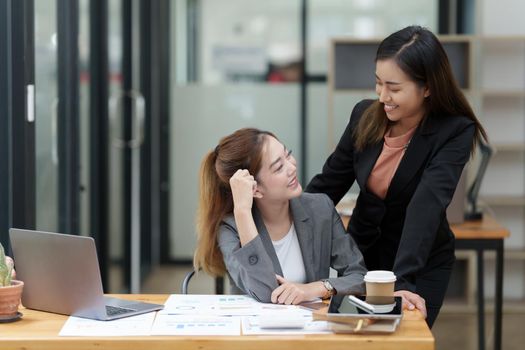 Two Happy business person discuss at workplace.