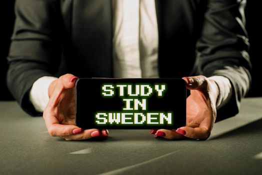 Conceptual display Study In Sweden, Word Written on Travel to European country for educational purposes Businessman in suit holding open palm symbolizing successful teamwork.