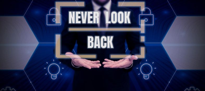 Text caption presenting Never Look Back, Internet Concept Do not have regrets for your actions be optimistic Male and female colleagues doing presentation on stage with hand gestures.