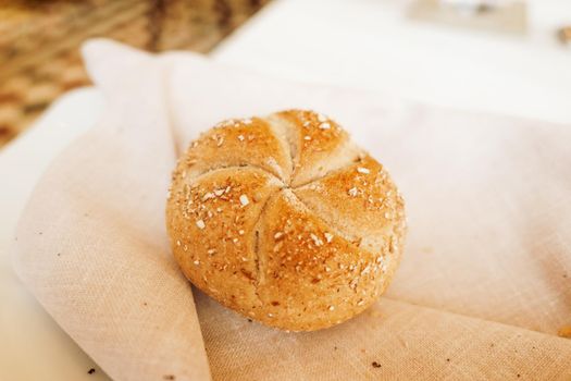 Gluten free pastry, eating out and healthy lifestyle concept - Fresh white bread in a restaurant