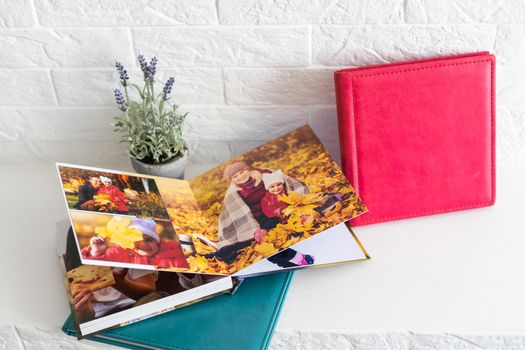 Luxury photo books in a leather cover on natural background