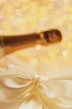 Romantic celebration, lifestyle and luxury present concept - The bottle of champagne and holiday gift box