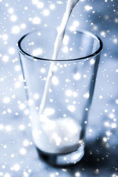 Dairy products, healthy diet and Christmas food concept - Magic holiday drink, pouring organic lactose free milk into glass on marble table