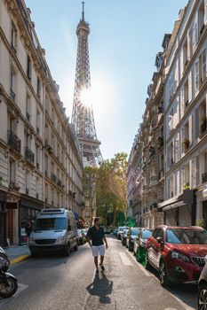 Young men watching sunrise by the Eiffel tower, Eiffel tower at Sunrise in Paris France, Paris Eifel tower on a summer day in the city of Paris France