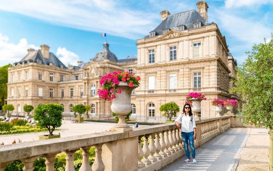 Asian women visit Le Jardin Luxembourg park in Paris during summer, people relax in the park. Jardin du Luxembourg - Jardines de Luxemburgo - Gardens of Luxembourg