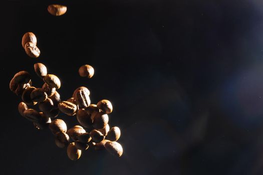 Several coffee beans isolated on black background with reflection. Culinary coffee background